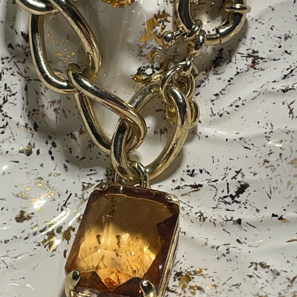 Gold tone link bracelet. With Smokey brown stone!